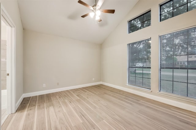 3301 Cliffview Dr, Corinth, TX 76210 - empty room with light wood-style floors, ceiling fan, high vaulted ceiling, and baseboards