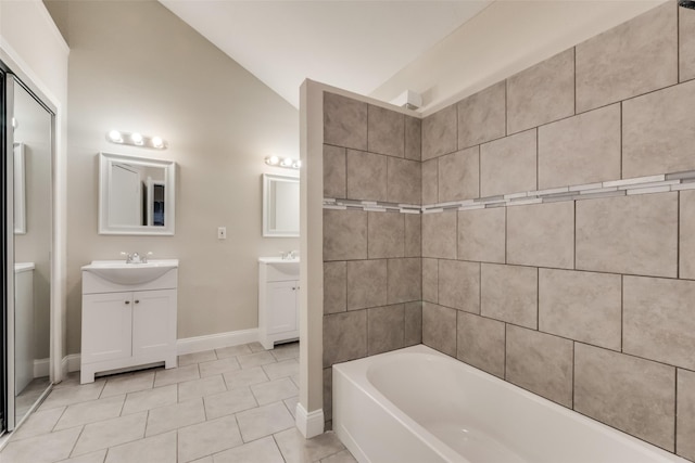 3301 Cliffview Dr, Corinth, TX 76210 - full bathroom featuring vaulted ceiling, vanity, baseboards, a tub, and tile patterned flooring