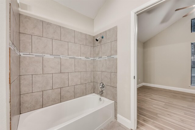 3301 Cliffview Dr, Corinth, TX 76210 - bathroom featuring lofted ceiling, baseboards,  shower combination, ceiling fan, and wood finished floors
