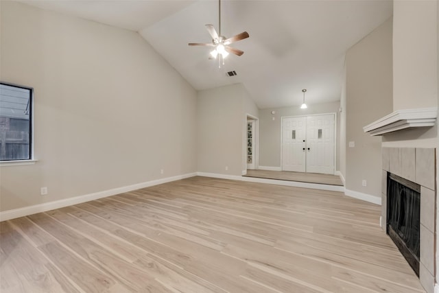 3301 Cliffview Dr, Corinth, TX 76210 - unfurnished living room featuring lofted ceiling, a fireplace, a ceiling fan, light wood-type flooring, and baseboards