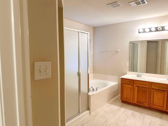 9404 Mirror Fountain Cir, Frisco, TX 75033 - bathroom featuring a stall shower, a garden tub, double vanity, and marble look tile flooring
