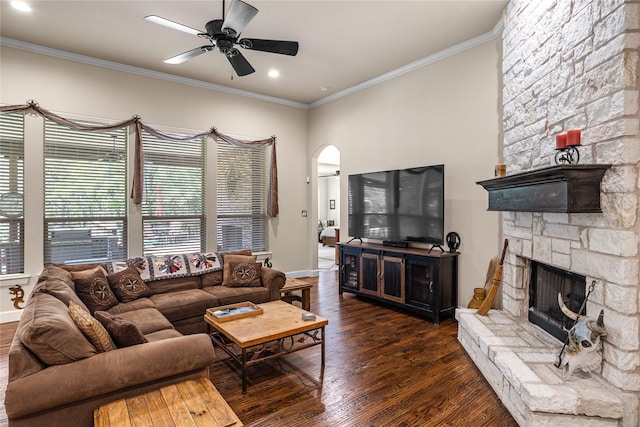5100 Swisher Rd, Denton, TX 76208 - living area featuring a stone fireplace, crown molding, a ceiling fan, wood finished floors, and baseboards