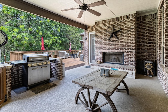 5100 Swisher Rd, Denton, TX 76208 - view of patio featuring an outdoor brick fireplace, a deck, a ceiling fan, and grilling area
