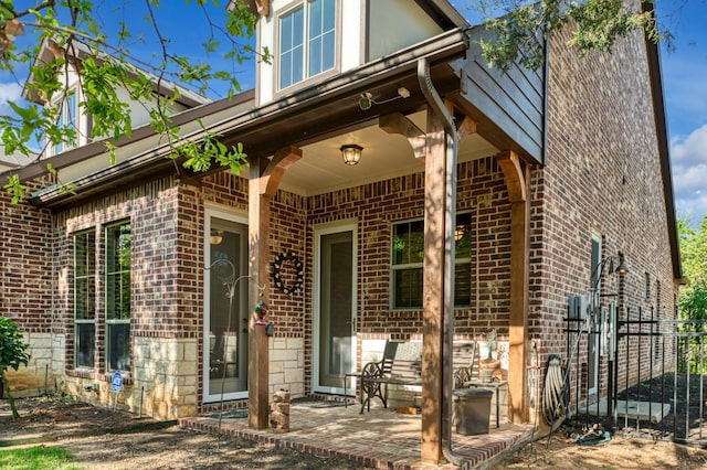 5100 Swisher Rd, Denton, TX 76208 - doorway to property with brick siding and a patio