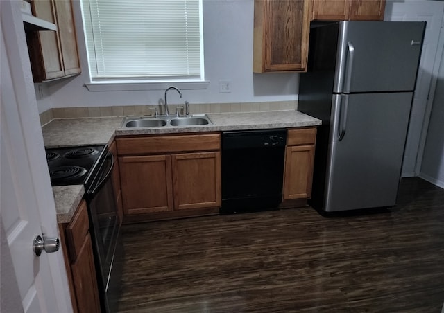 4214 Mehalia Dr, Dallas, TX 75241 - kitchen featuring dishwasher, freestanding refrigerator, a sink, range with electric cooktop, and dark wood-style flooring
