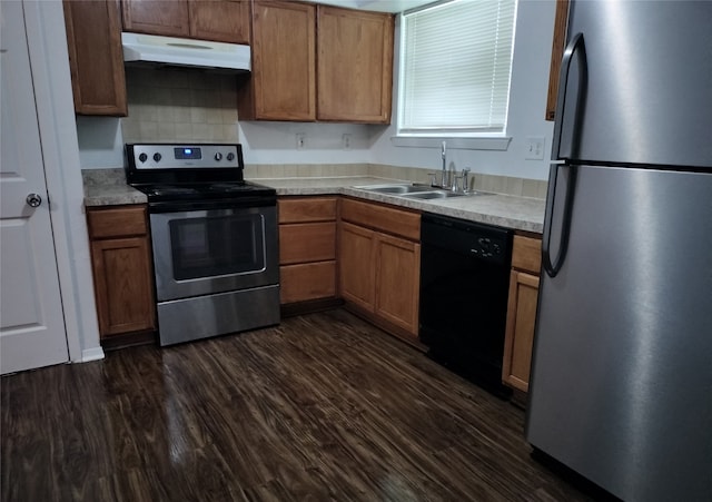4214 Mehalia Dr, Dallas, TX 75241 - kitchen with stainless steel appliances, a sink, under cabinet range hood, and light countertops