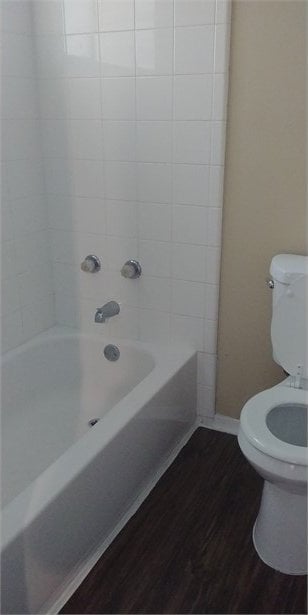 4214 Mehalia Dr, Dallas, TX 75241 - bathroom with toilet, wood finished floors, tub / shower combination, and baseboards