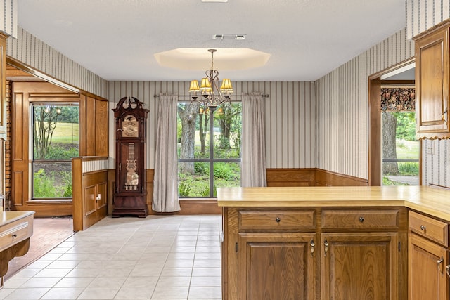 3837 Fm 896th 2, Leonard, TX 75452 - kitchen with wallpapered walls, a chandelier, light countertops, light tile patterned floors, and hanging light fixtures