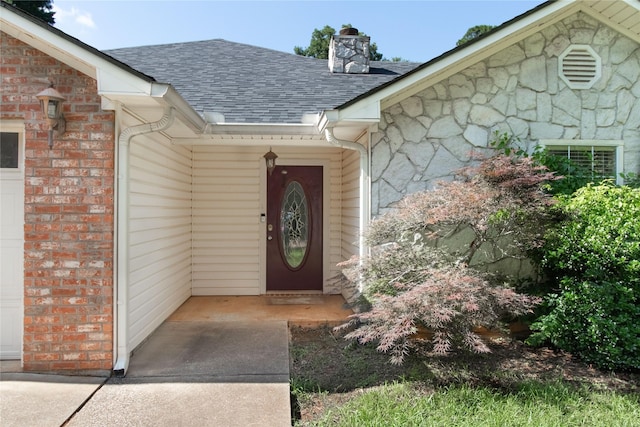 10763 Nix Ln, Whitehouse, TX 75791 - entrance to property with roof with shingles, stone siding, and a chimney