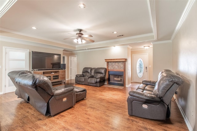 10763 Nix Ln, Whitehouse, TX 75791 - living room with wood finished floors, ceiling fan, a tile fireplace, crown molding, and baseboards