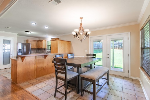 10763 Nix Ln, Whitehouse, TX 75791 - dining space featuring ornamental molding, a chandelier, and french doors