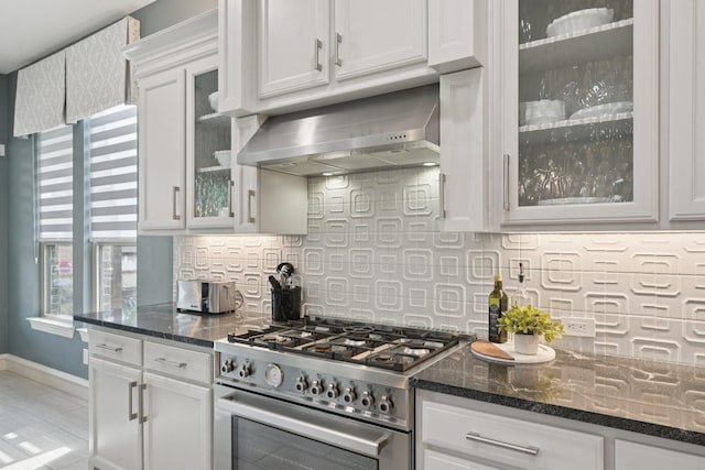 4158 Benchmark Ln, Frisco, TX 75034 - kitchen featuring high end range, wall chimney range hood, backsplash, and white cabinetry