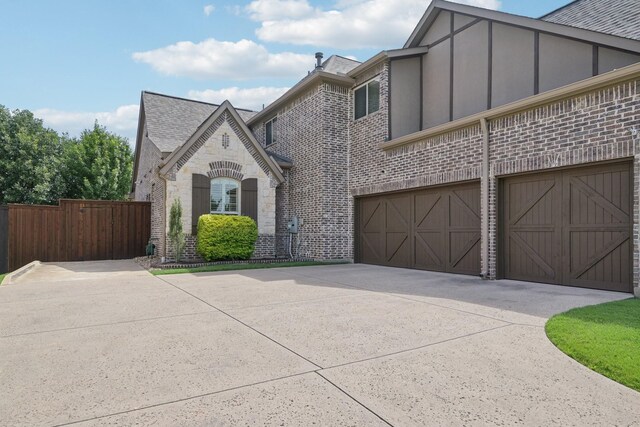 4158 Benchmark Ln, Frisco, TX 75034 - view of front of house with concrete driveway, brick siding, an attached garage, and roof with shingles