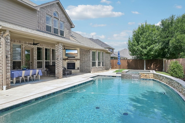 4158 Benchmark Ln, Frisco, TX 75034 - view of pool with an outdoor fireplace, a patio area, a fenced backyard, and a pool with connected hot tub