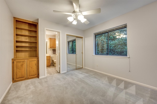 2308 Aberdeen Bnd, Carrollton, TX 75007 - unfurnished bedroom featuring light colored carpet, a ceiling fan, and connected bathroom