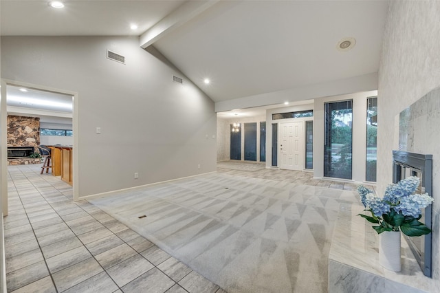 2308 Aberdeen Bnd, Carrollton, TX 75007 - unfurnished living room featuring a fireplace, high vaulted ceiling, beam ceiling, light tile patterned floors, and light carpet