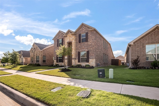 1225 Milfoil Dr, Justin, TX 76247 - traditional-style home with brick siding, a front yard, and stone siding