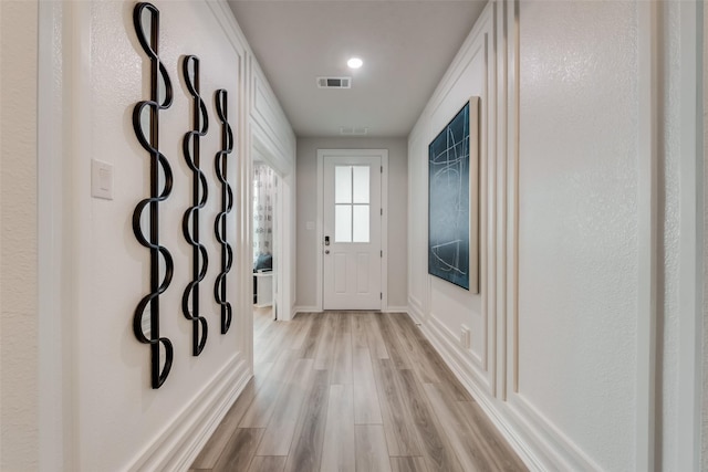 3445 Cross Shore Dr, Anna, TX 75409 - doorway to outside featuring light wood-style flooring and baseboards