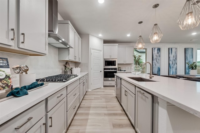 3445 Cross Shore Dr, Anna, TX 75409 - kitchen with wall chimney exhaust hood, a sink, stainless steel appliances, light countertops, and recessed lighting