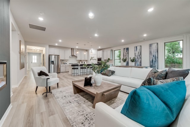 3445 Cross Shore Dr, Anna, TX 75409 - living room with light wood finished floors, plenty of natural light, recessed lighting, and baseboards