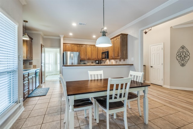 1908 Thompson Ct, Flower Mound, TX 75028 - dining space featuring crown molding, recessed lighting, and light tile patterned floors