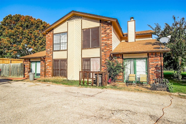 675 Harbor Dr N, Azle, TX 76020 - view of front of property with brick siding, a chimney, and a shingled roof