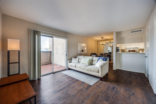 12834 Midway Rd Unit 1105, Dallas, TX 75244 - living room with a chandelier and dark wood-style flooring