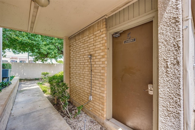 12834 Midway Rd Unit 1105, Dallas, TX 75244 - property entrance featuring brick siding