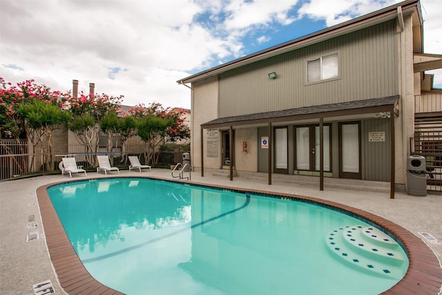 12834 Midway Rd Unit 1105, Dallas, TX 75244 - community pool featuring a patio area
