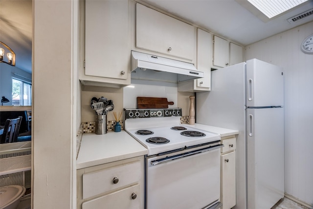 12834 Midway Rd Unit 1105, Dallas, TX 75244 - kitchen featuring white appliances, under cabinet range hood, light countertops, and white cabinetry