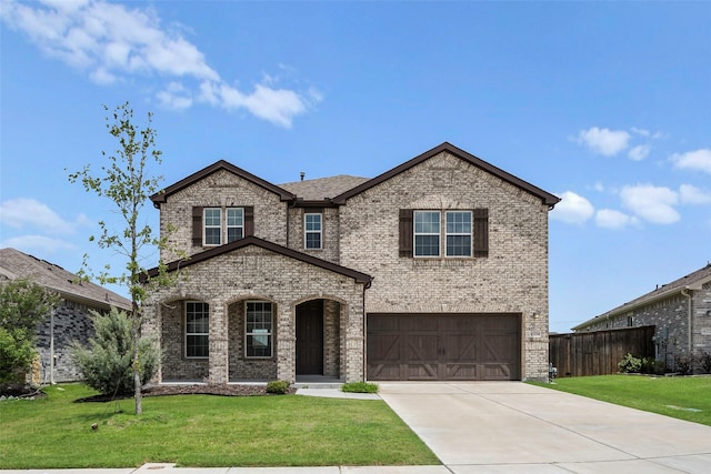 4224 Wood River Trl, Prosper, TX 75078 - view of front of home with brick siding, a garage, and concrete driveway
