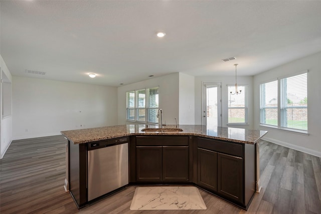 4224 Wood River Trl, Prosper, TX 75078 - kitchen with dishwasher, a sink, dark wood finished floors, light stone counters, and recessed lighting