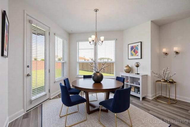 4224 Wood River Trl, Prosper, TX 75078 - dining room featuring a chandelier, wood finished floors, and baseboards