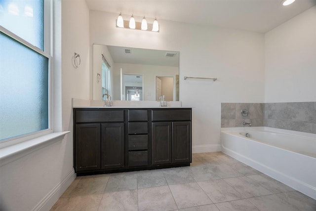 4224 Wood River Trl, Prosper, TX 75078 - full bathroom featuring double vanity, a bath, baseboards, and tile patterned floors