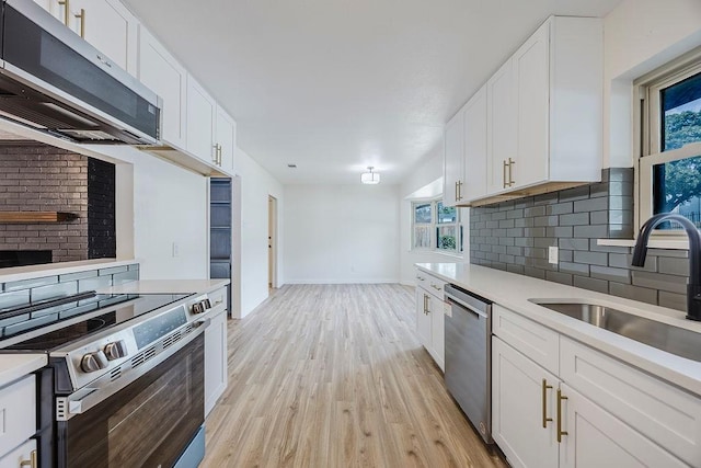 6509 S Hulen St, Fort Worth, TX 76133 - kitchen featuring appliances with stainless steel finishes, backsplash, a sink, and light countertops