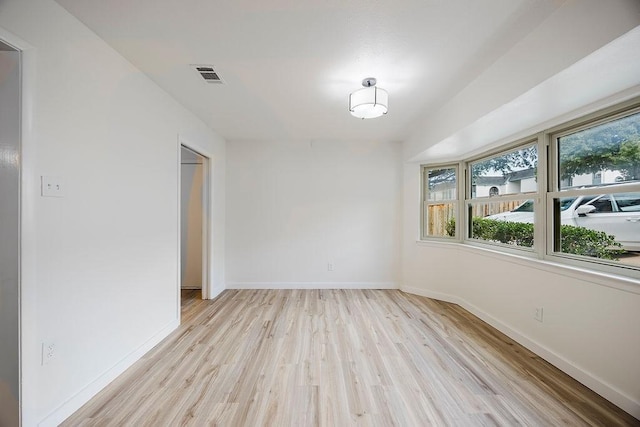 6509 S Hulen St, Fort Worth, TX 76133 - empty room featuring healthy amount of natural light, light wood finished floors, and baseboards