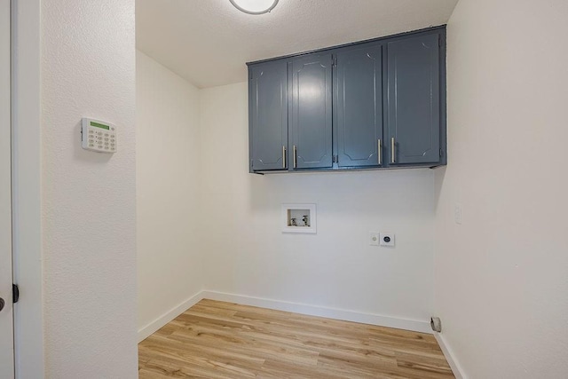 6509 S Hulen St, Fort Worth, TX 76133 - washroom featuring electric dryer hookup, washer hookup, cabinet space, and light wood-type flooring