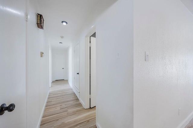 6509 S Hulen St, Fort Worth, TX 76133 - hallway featuring light wood-type flooring and baseboards