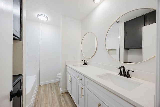 6509 S Hulen St, Fort Worth, TX 76133 - full bath with double vanity, wood finished floors, and toilet