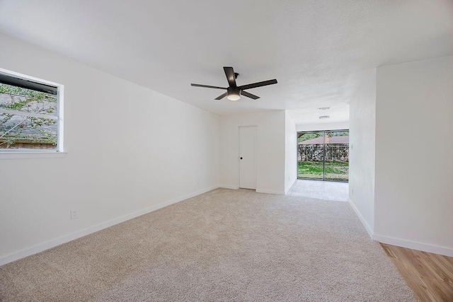 6509 S Hulen St, Fort Worth, TX 76133 - unfurnished room featuring a ceiling fan, baseboards, and light carpet