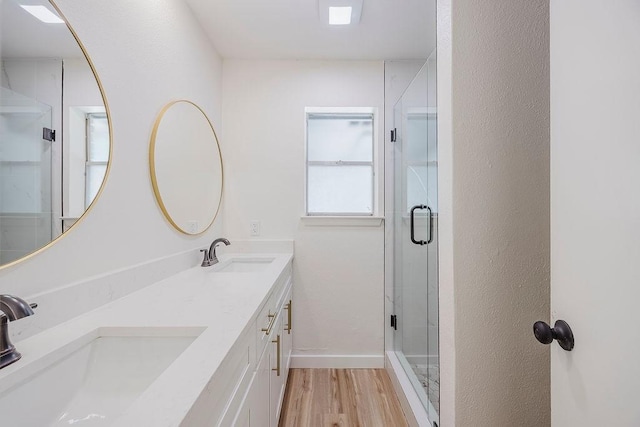 6509 S Hulen St, Fort Worth, TX 76133 - full bath featuring double vanity, wood finished floors, a shower stall, and baseboards
