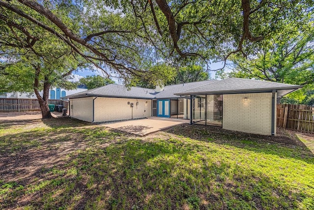 6509 S Hulen St, Fort Worth, TX 76133 - rear view of property with brick siding and a patio