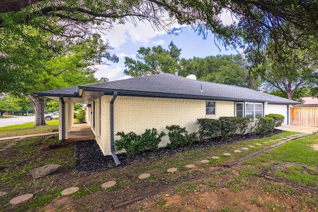 6509 S Hulen St, Fort Worth, TX 76133 - view of home's exterior with brick siding and a shingled roof
