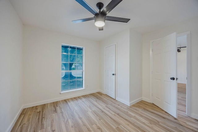 6509 S Hulen St, Fort Worth, TX 76133 - unfurnished bedroom with light wood-type flooring, baseboards, and ceiling fan