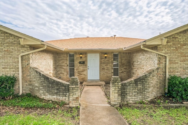 715 San Juan Dr, Duncanville, TX 75116 - property entrance with brick siding and roof with shingles
