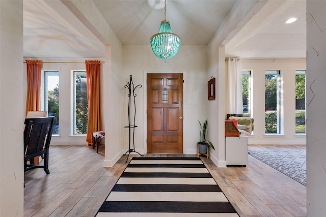 8608 Funtier Ct, Fort Worth, TX 76179 - foyer featuring light wood-type flooring, a chandelier, and baseboards
