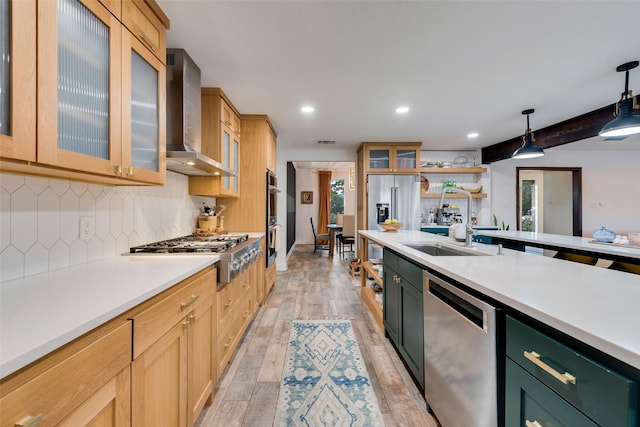 8608 Funtier Ct, Fort Worth, TX 76179 - kitchen with stainless steel appliances, wall chimney range hood, recessed lighting, a sink, and light countertops