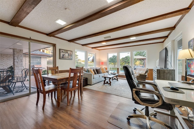 8608 Funtier Ct, Fort Worth, TX 76179 - dining space with wood finished floors, beamed ceiling, an office area, and a textured ceiling
