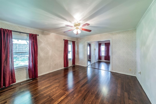 612 W Simmons St, Weatherford, TX 76086 - spare room with crown molding, healthy amount of natural light, wood finished floors, wallpapered walls, and ceiling fan