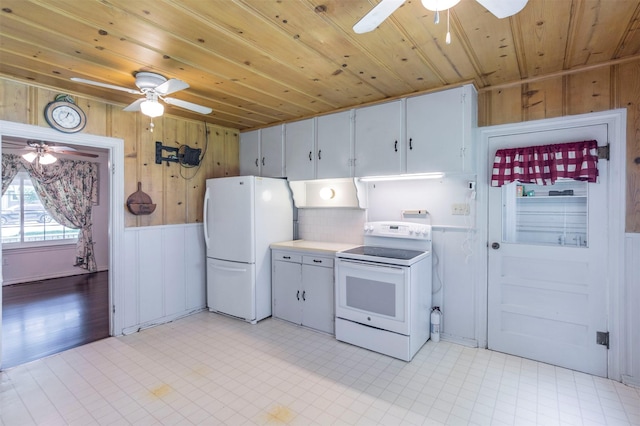 612 W Simmons St, Weatherford, TX 76086 - kitchen with white appliances, ceiling fan, wooden ceiling, wood walls, and light countertops